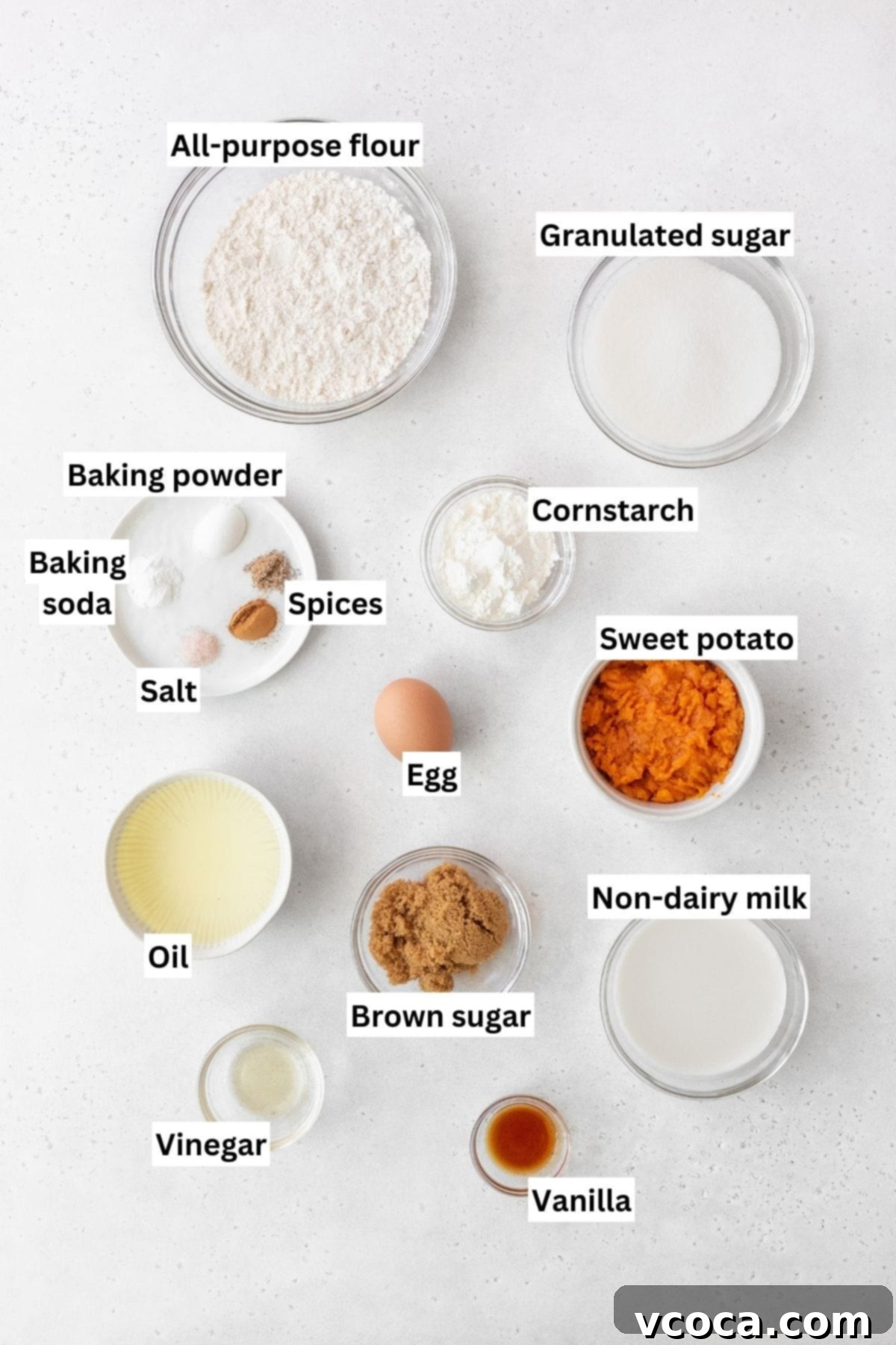 Spiced Sweet Potato Cake with Cashew Frosting 4 Overhead shot of sweet potato cake ingredients measure out into bowls.