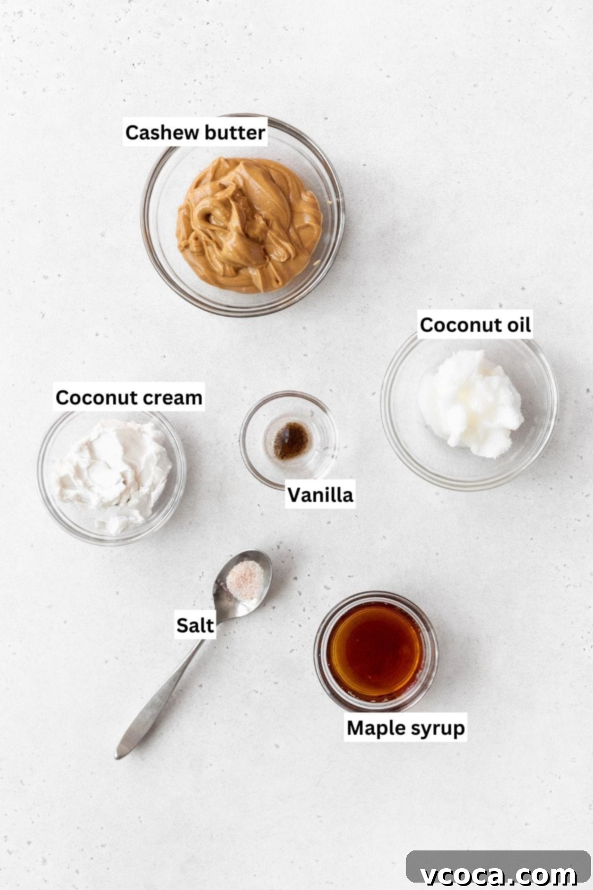 Spiced Sweet Potato Cake with Cashew Frosting 5 Overhead shot of maple cashew frosting ingredients on a white surface.