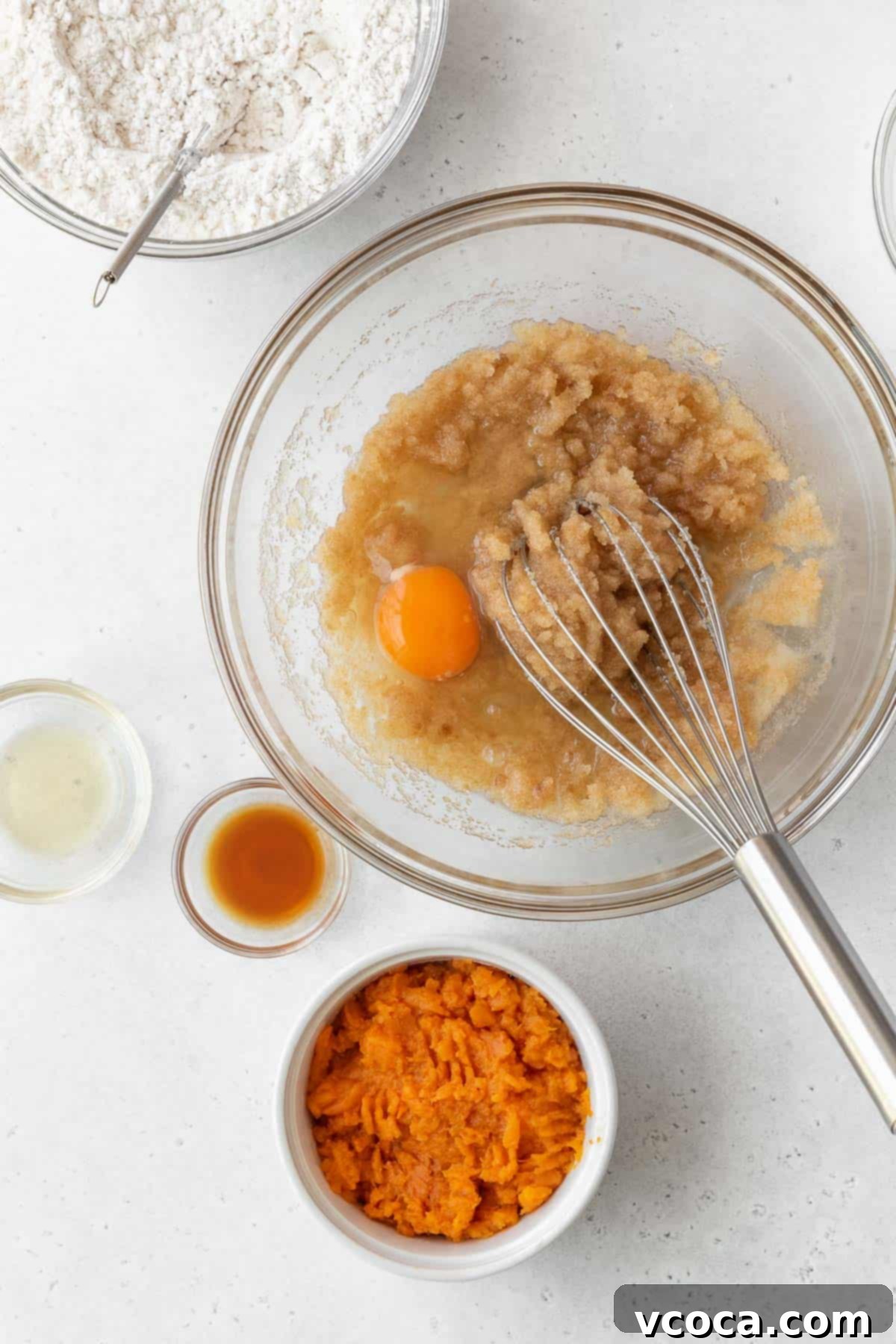 Spiced Sweet Potato Cake with Cashew Frosting 9 Whisking an egg into the oil and sugar mixture.