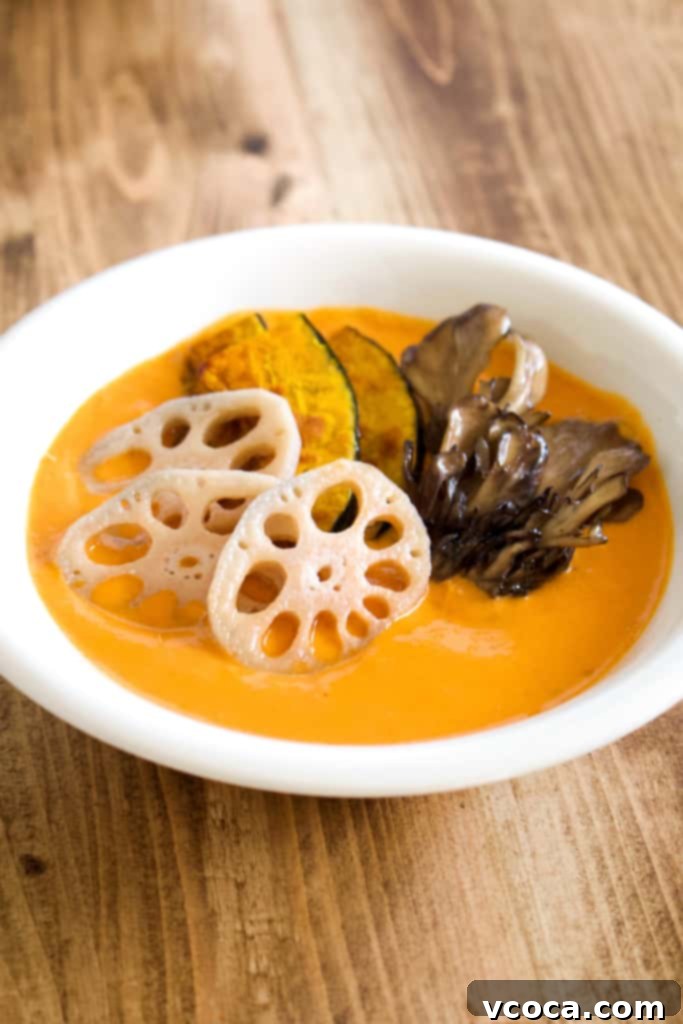 A top-down view of a delicious vegan coconut curry, brimming with vegetables and a rich, spicy sauce, ready to be enjoyed. A perfect hearty and healthy plant-based meal.