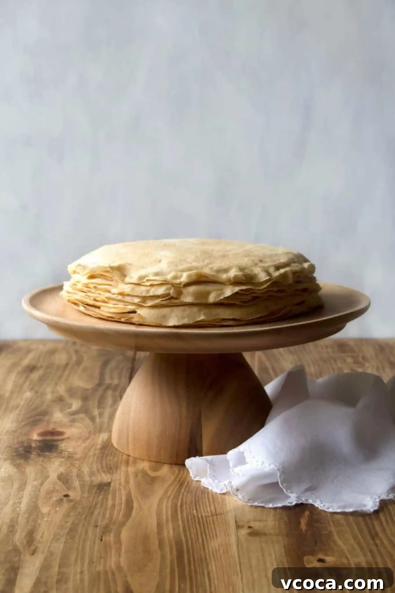 Golden Vegan Dulce de Leche Mille Crepe Cake 4 Homemade vegan dulce de leche in a baking pan, showing its rich caramel color and smooth texture after cooking.