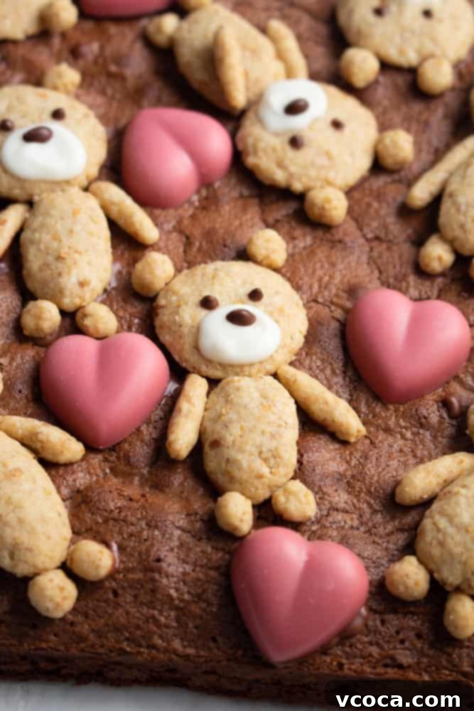 Sweetheart Teddy Bear Brownies 4 Hand-shaped oatmeal cookie dough taking the form of cute teddy bears, ready for baking and topping the brownies.