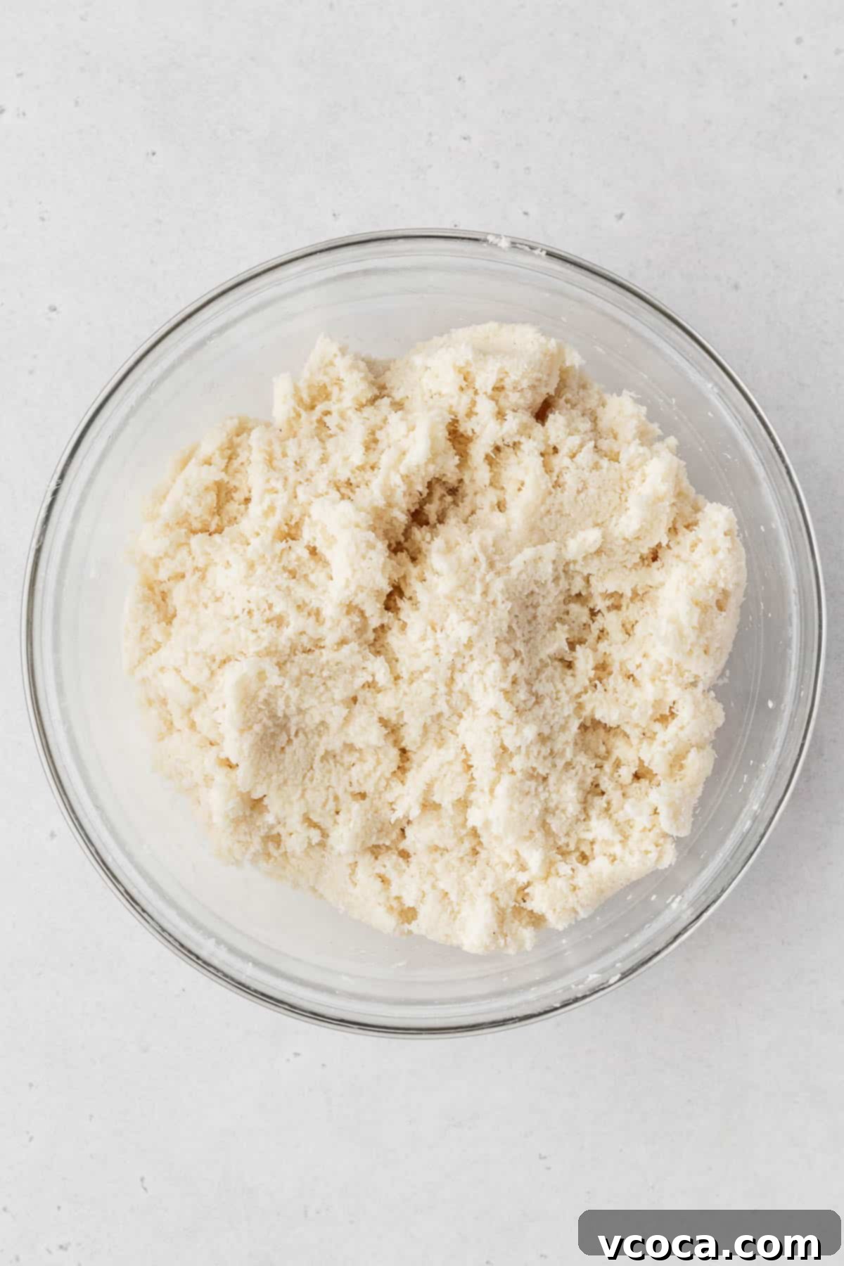 Heavenly Vegan Coconut Macaroons 5 Vegan coconut macaroon dough in a glass bowl.
