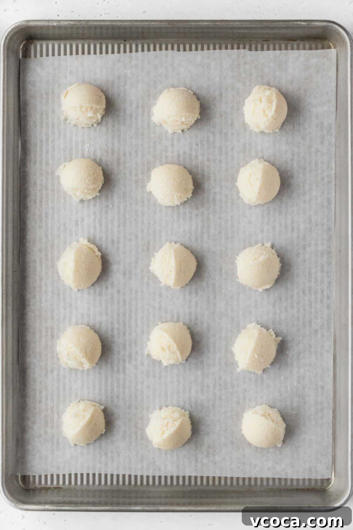 Heavenly Vegan Coconut Macaroons 6 Vegan macaroon dough on a parchment paper lined baking sheet.