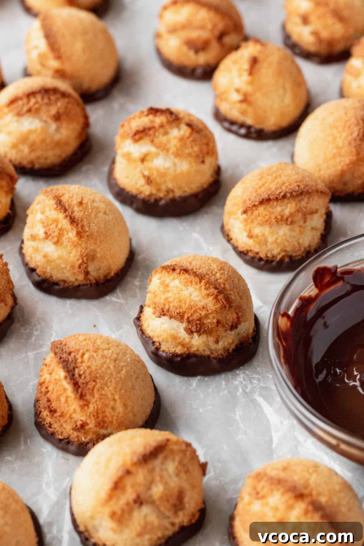 Heavenly Vegan Coconut Macaroons 8 Coconut macaroons with the bottoms dipped in chocolate.