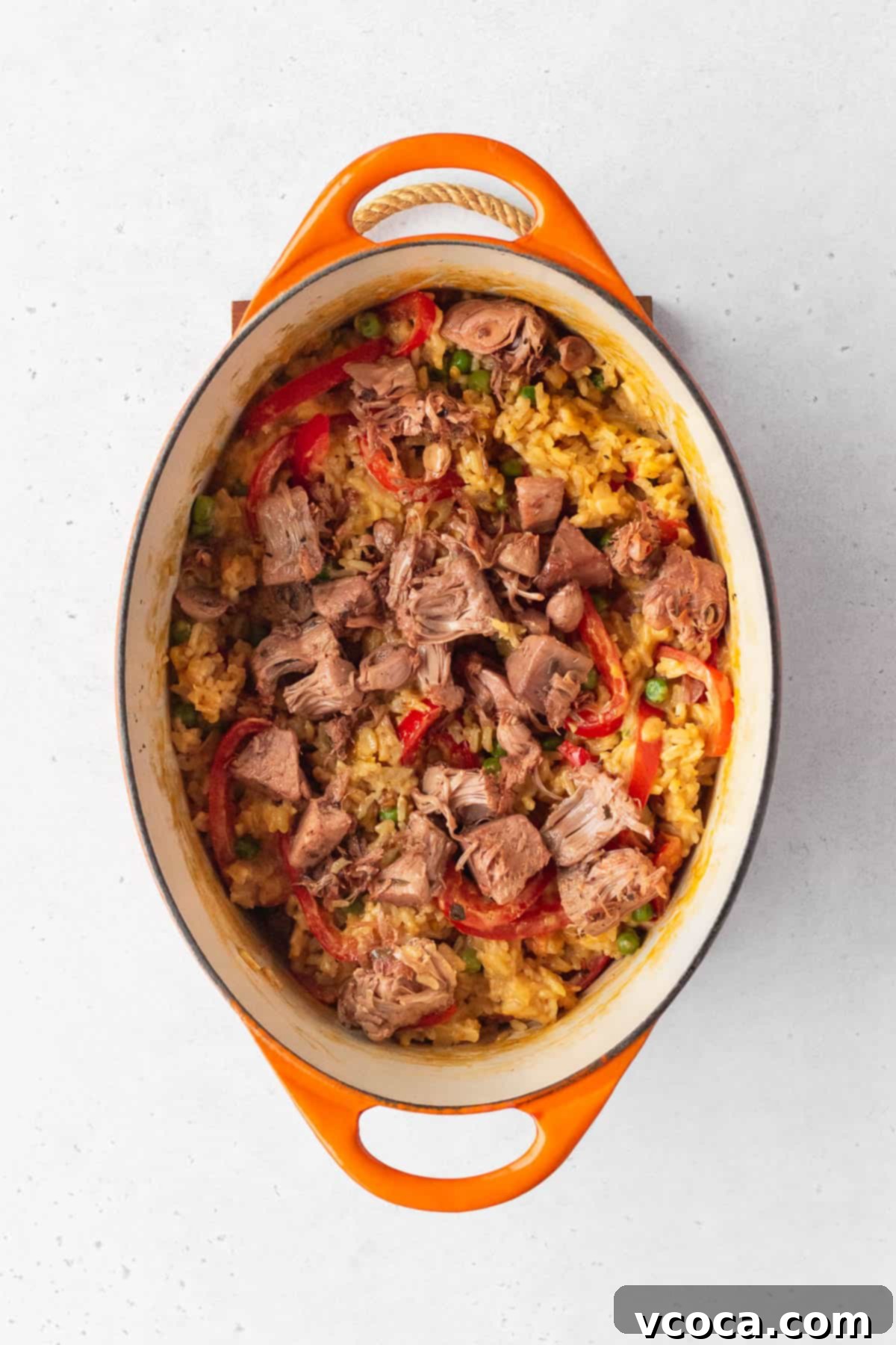 Flavorful Vegan Arroz Valenciana 11 Crispy jackfruit pieces are artfully arranged on top of the cooked rice, adding a delightful textural contrast.
