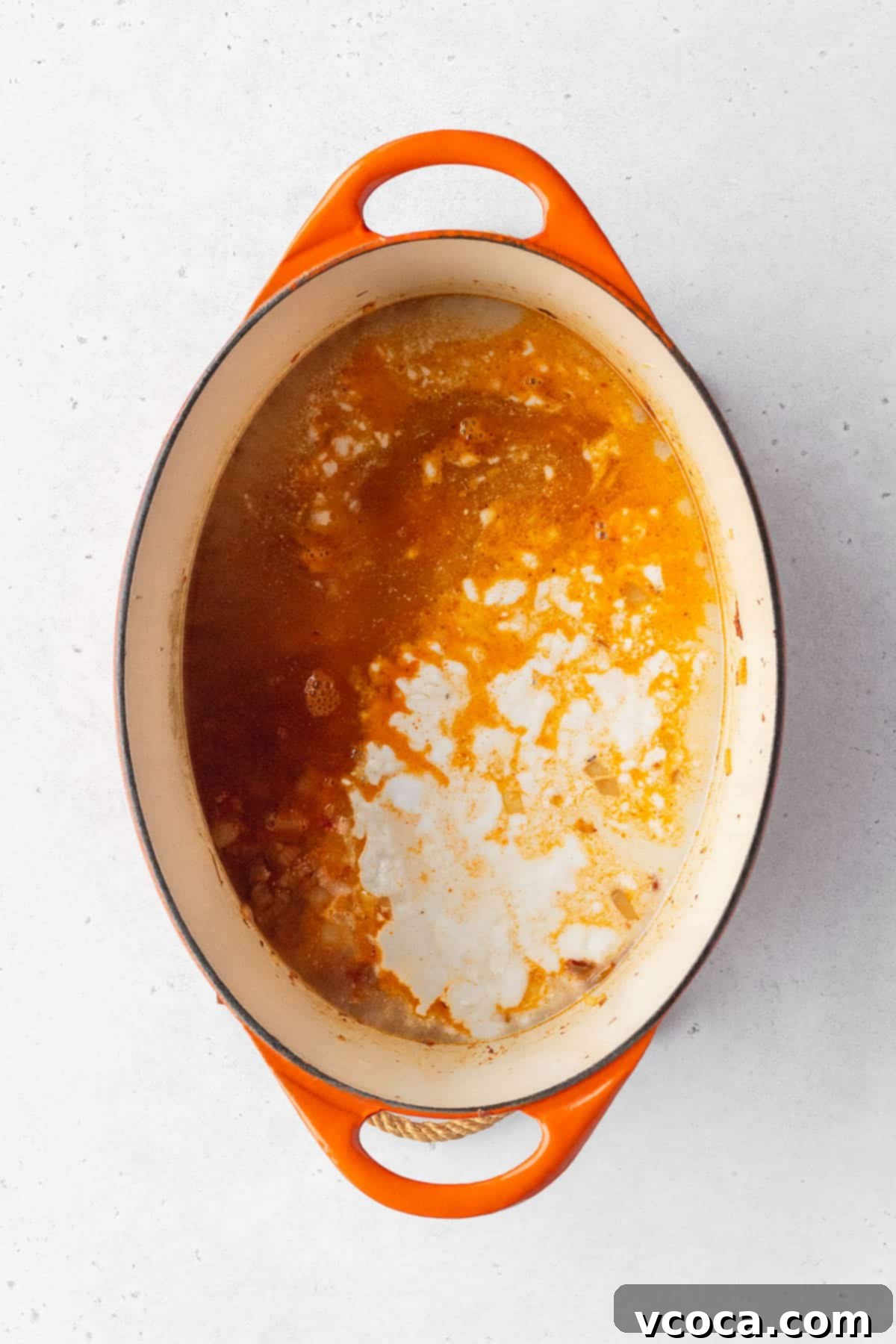 Flavorful Vegan Arroz Valenciana 8 Vegetable stock and coconut milk are added to the pot, creating the creamy base for the rice.