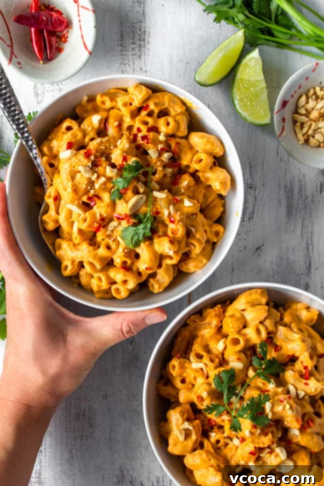 One Pot Vegan Red Curry Mac and Cheese 3 Close-up shot of creamy vegan red curry mac and cheese, showcasing the rich texture and vibrant color. A perfect plant-based comfort meal.