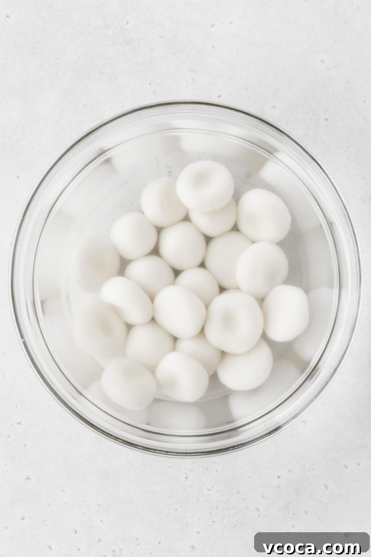 Pearl Rice Dumplings 13 Boiled shiratama cooling in a glass bowl of cold water.