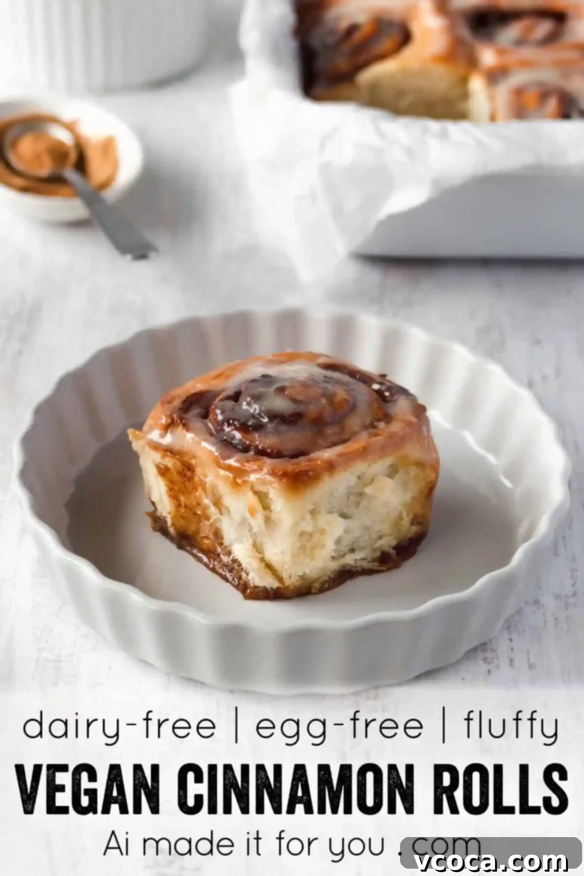 Pillowy Vegan Cinnamon Rolls with Dreamy Cashew Cream Frosting 13 Three vegan cinnamon rolls, glistening with icing, on a rustic background