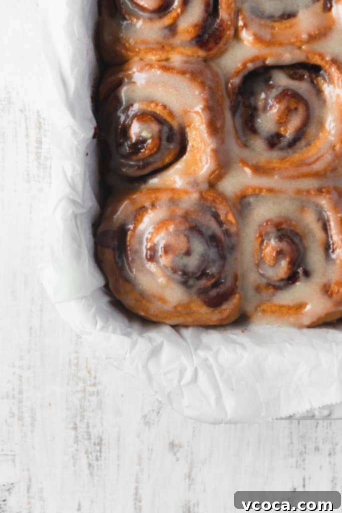 Pillowy Vegan Cinnamon Rolls with Dreamy Cashew Cream Frosting 8 A whole pan of perfectly baked vegan cinnamon rolls with their swirls visible