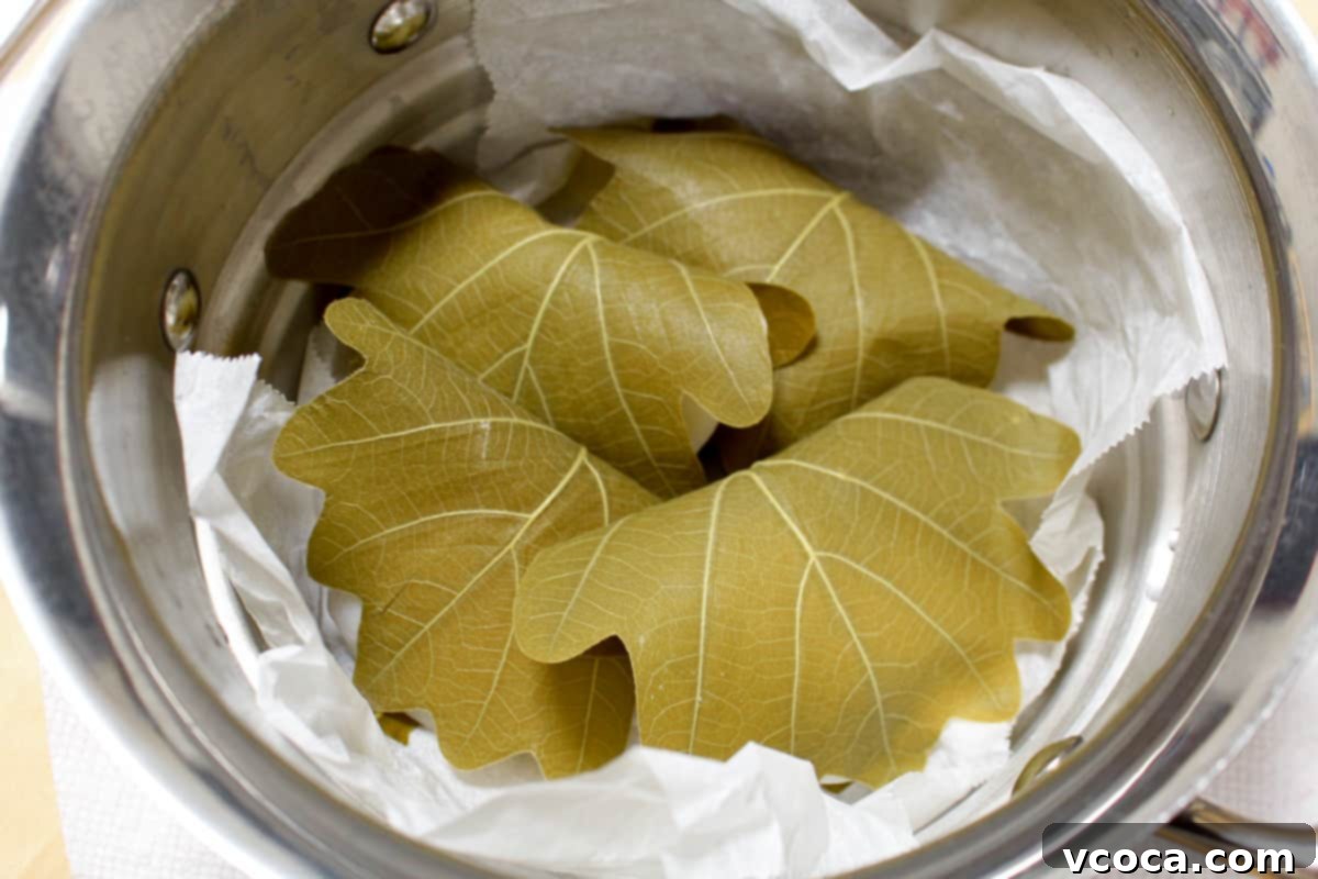 Kashiwa wrapped mochi added to a parchment-lined steamer.