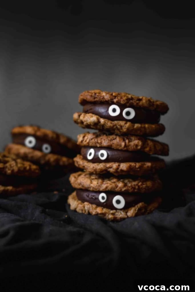 Wickedly Easy Halloween Cookies 2 Delicious and easy-to-make spooky Halloween cookies with chocolate fudge filling, perfect for any Halloween party. No food coloring needed for these adorable monster cookies!