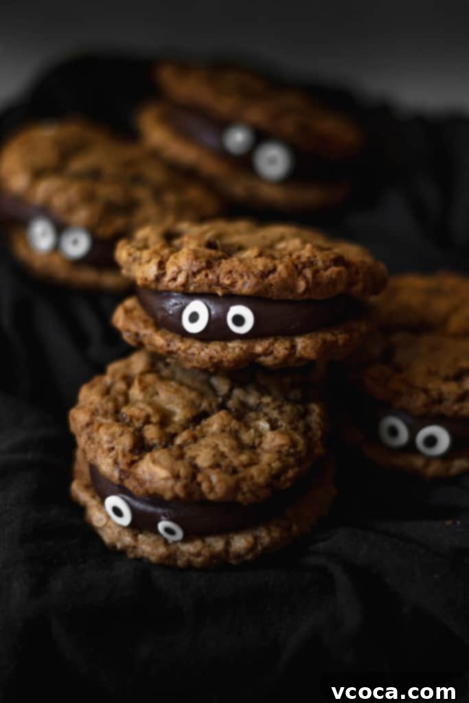 Wickedly Easy Halloween Cookies 4 Rich chocolate fudge sandwiched between two chewy oatmeal cookies, creating a perfect and easy spooky Halloween treat for parties.