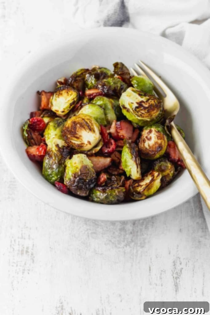Irresistible Bacon Cranberry Pecan Roasted Brussels Sprouts 5 Freshly roasted Brussels sprouts ready to be mixed with cranberries and pecans. A healthy and delicious Thanksgiving side dish.