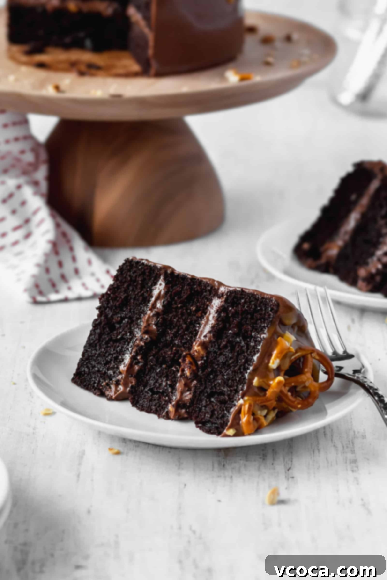 Salty-Sweet Chocolate Crunch Cake 8 A slice of moist and fluffy chocolate cake with peanuts, pretzels, and chocolate buttercream frosting
