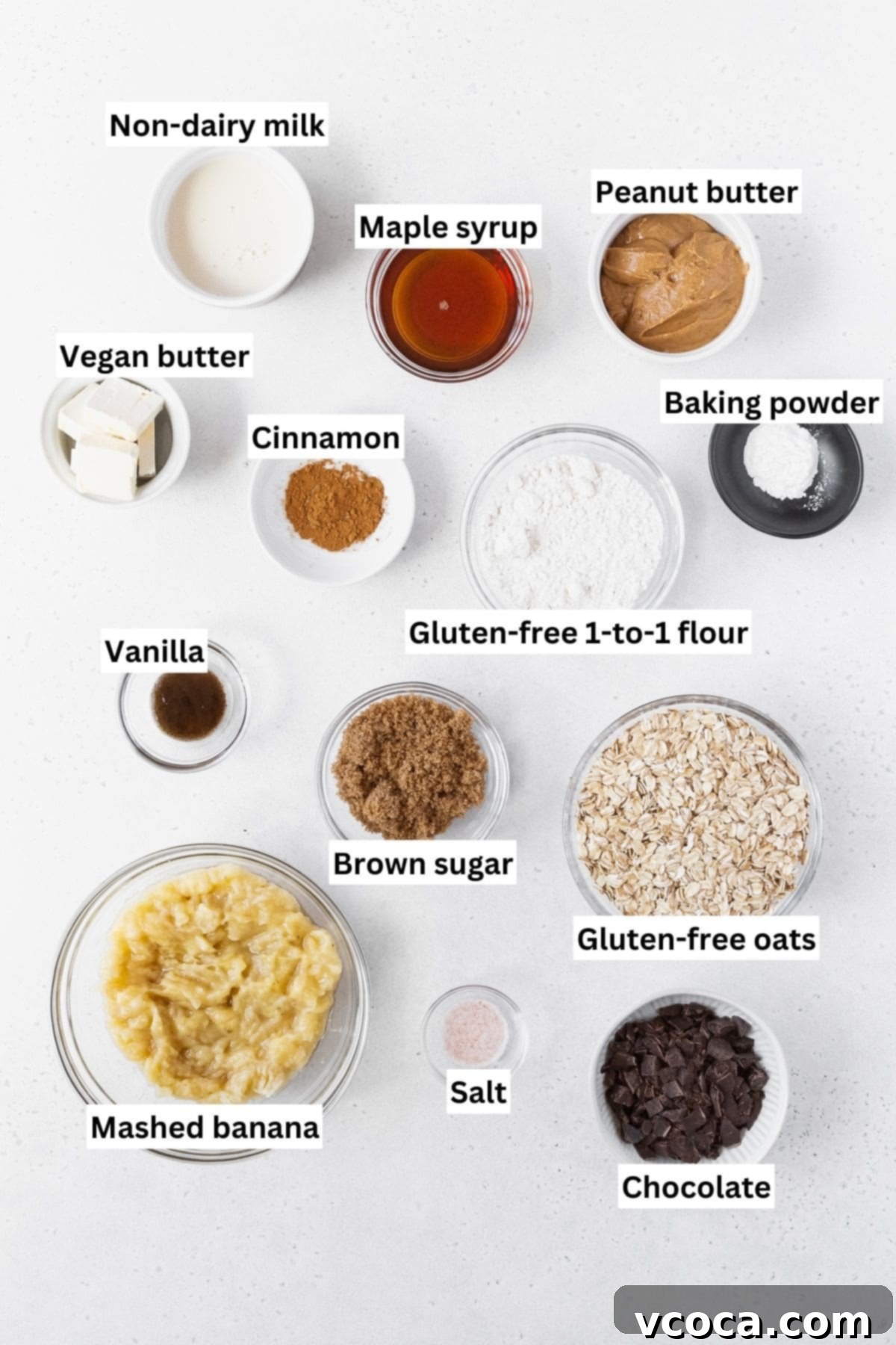 Gluten Free Peanut Butter Oatmeal Breakfast Bars 4 All of the ingredients for peanut butter banana oatmeal bars on a white background.