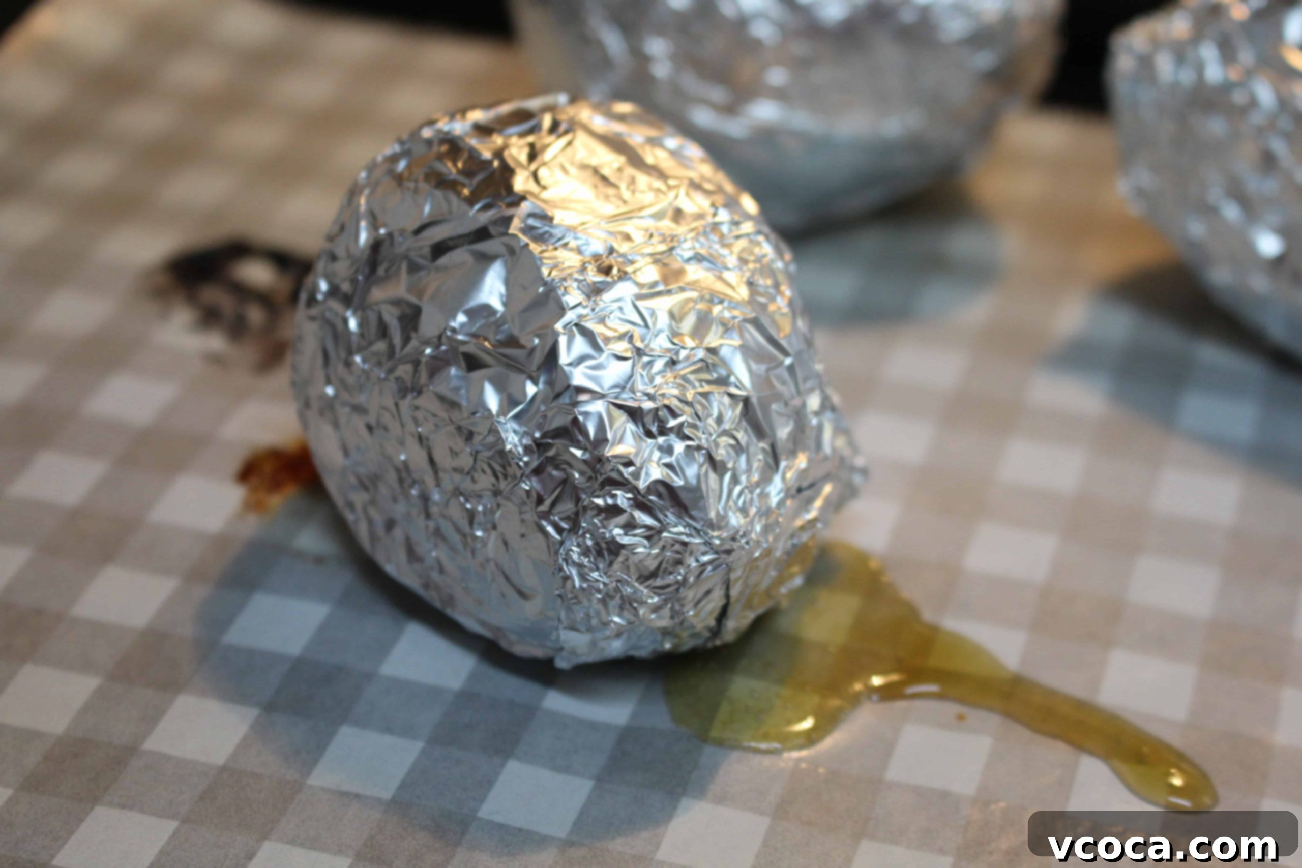 Caramelized Japanese Sweet Potatoes 5 A tray of Annoh-imo Japanese sweet potatoes wrapped in aluminum foil, ready for the oven.