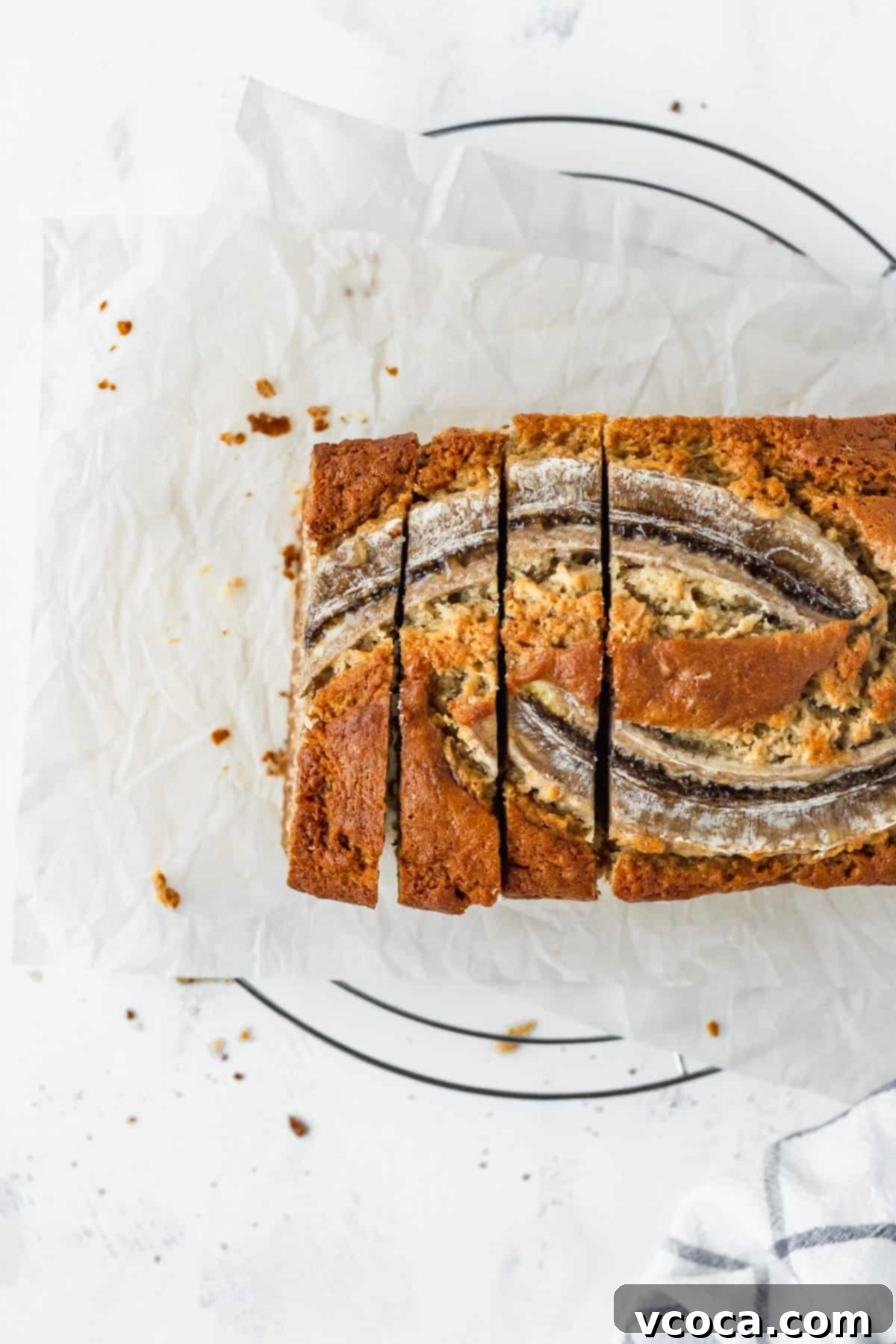 An overhead shot of super moist banana bread that's been sliced.