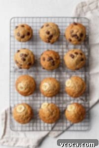 Twelve banana muffins cooling on a wire rack.