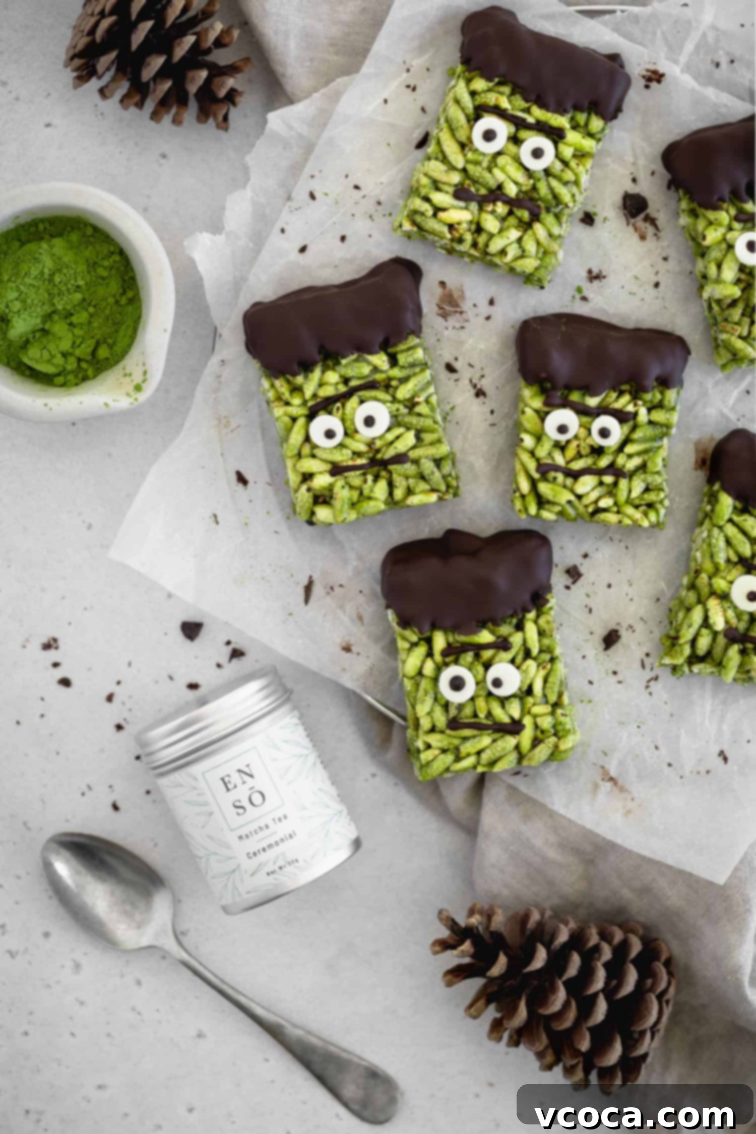 Franken-Matcha Crispies 4 Frankenstein rice crispy treats next to a can of matcha powder
