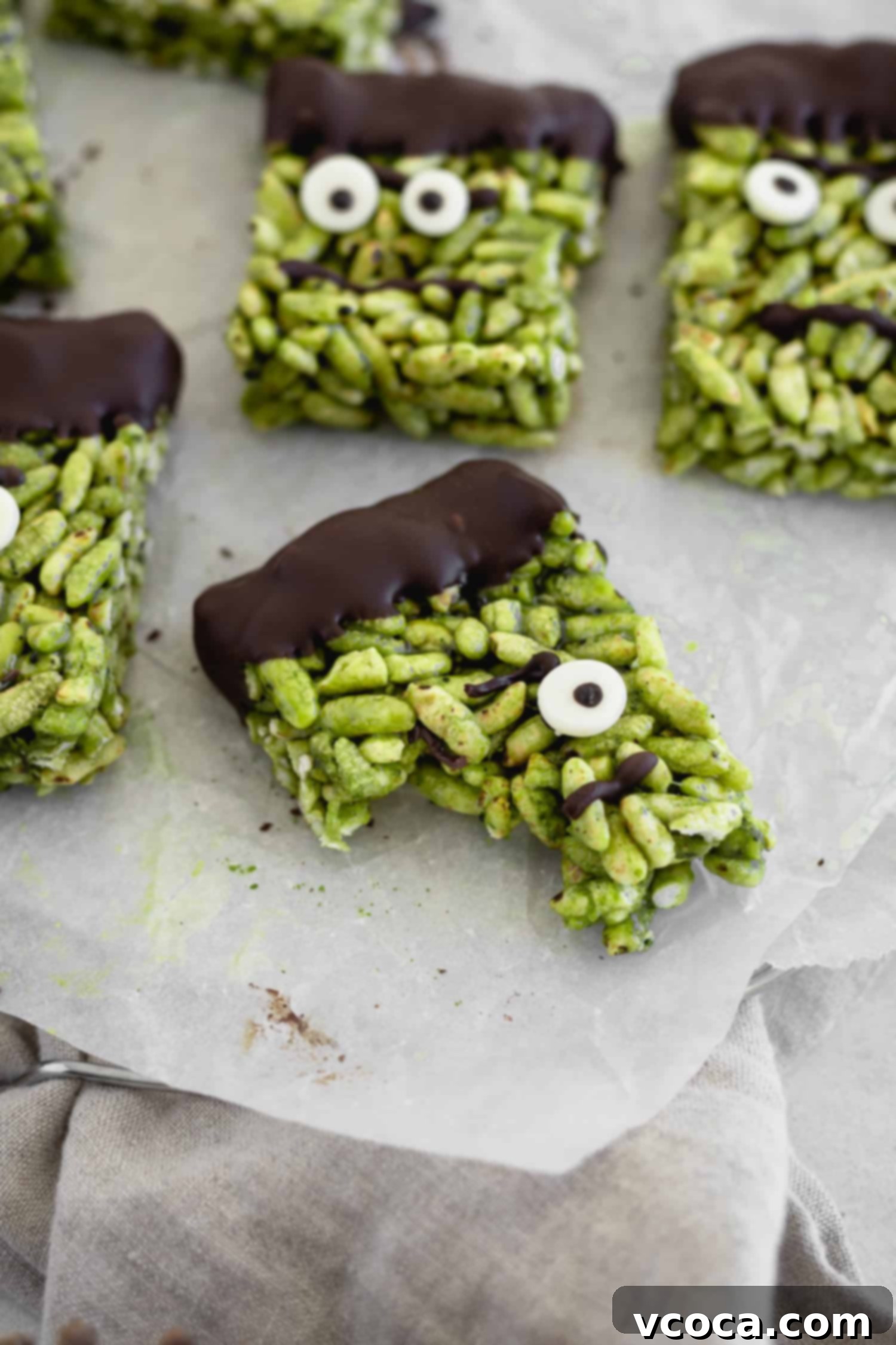 Franken-Matcha Crispies 6 A bitten piece of green Halloween treat showing gooey texture