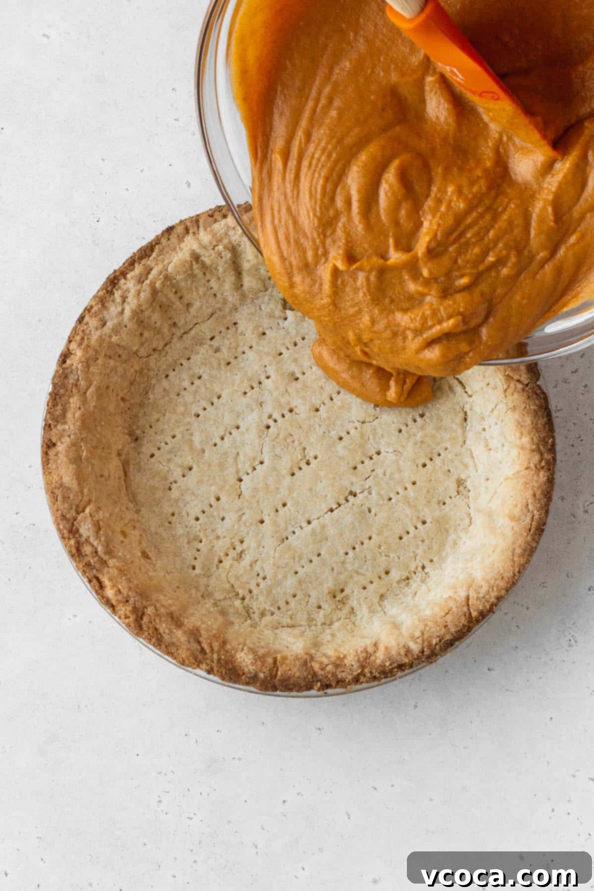 Wholesome Vegan Pumpkin Perfection 15 Dairy free pumpkin pie filling poured into the baked pie crust.