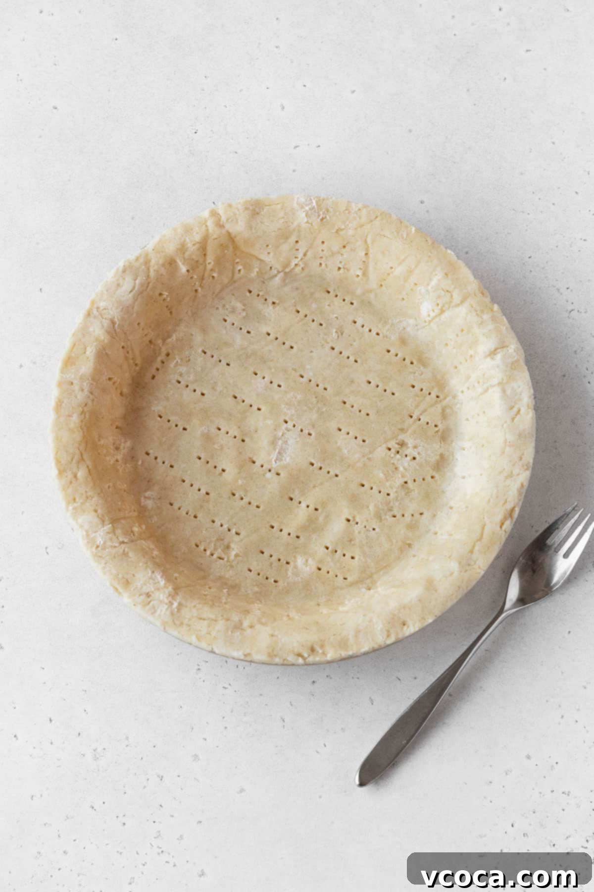 Wholesome Vegan Pumpkin Perfection 10 Pie dough pressed into a pie plate.