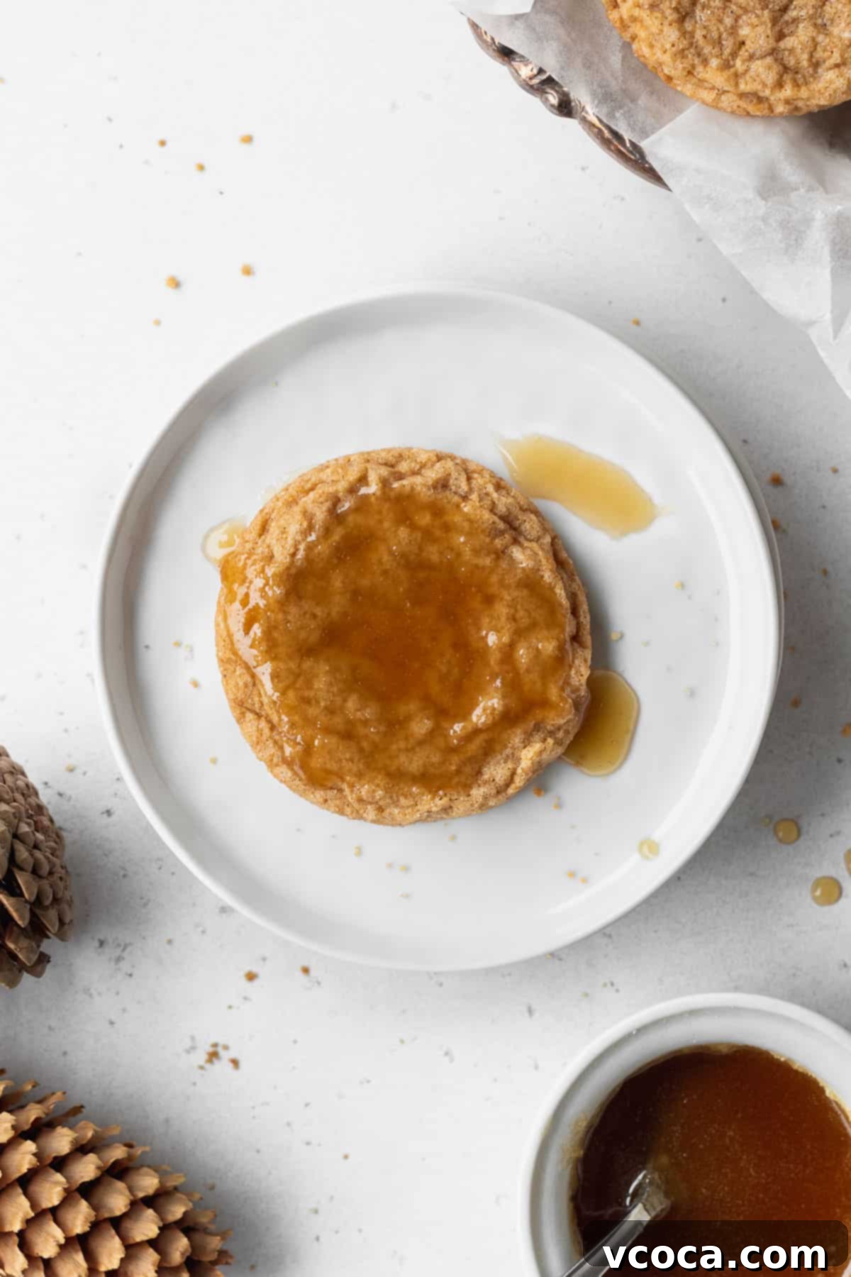 Heavenly Chewy Gluten-Free Ginger Cookies 13 A single, perfectly glazed ginger cookie, showcasing its enticing shine and inviting texture.