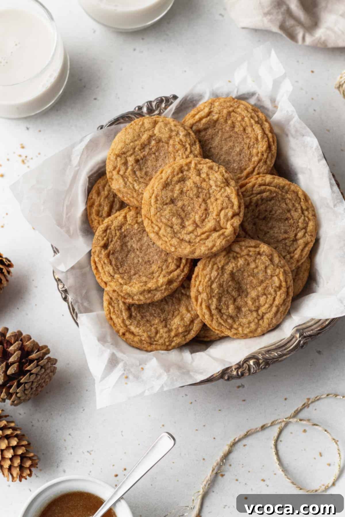 Heavenly Chewy Gluten-Free Ginger Cookies 16 A simple white plate holding a delightful assortment of freshly baked ginger cookies, ready to be enjoyed.