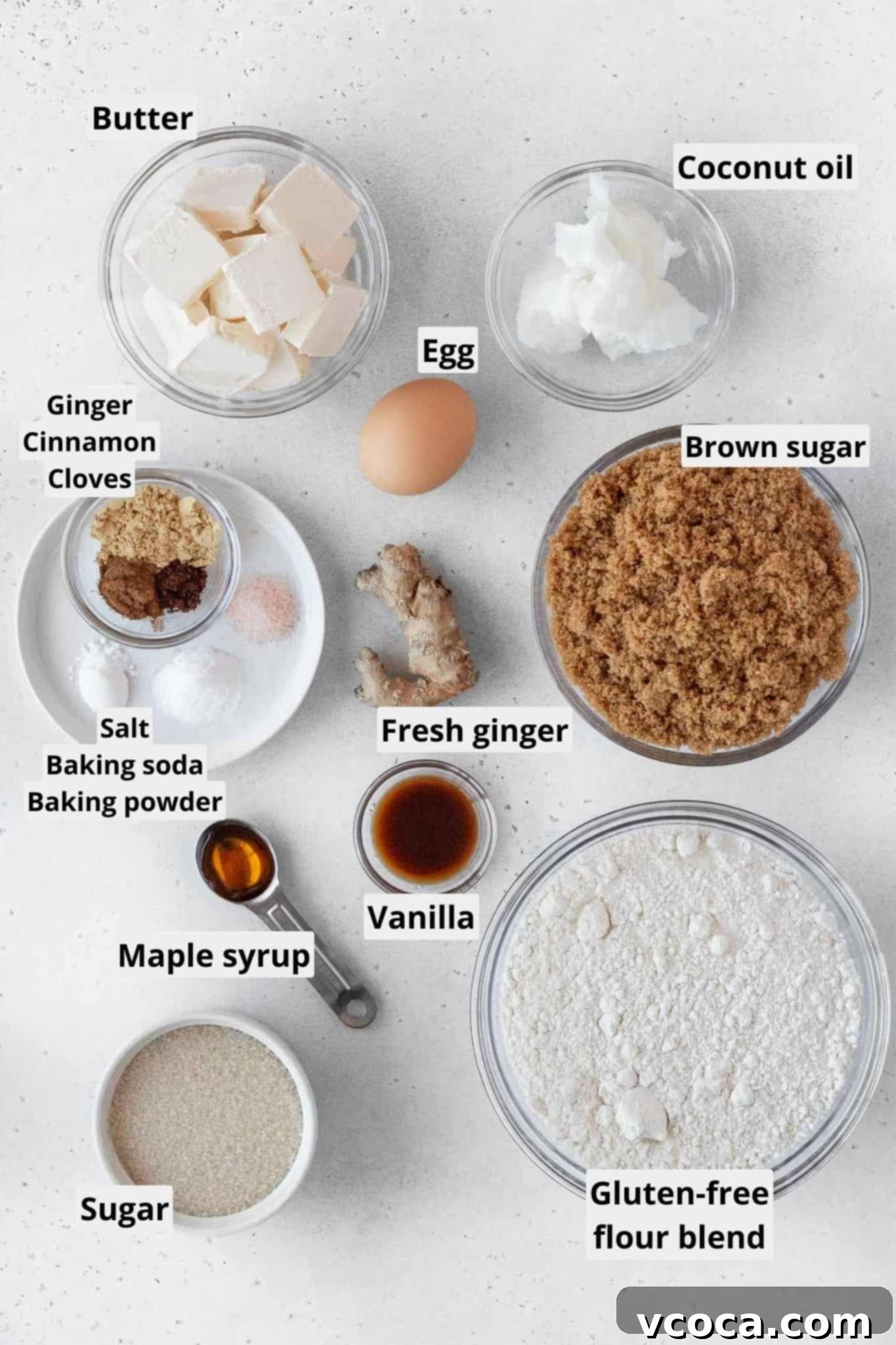 Heavenly Chewy Gluten-Free Ginger Cookies 5 A collection of gluten-free ginger cookies ingredients laid out on a rustic surface, including flour, spices, sugar, and butter.