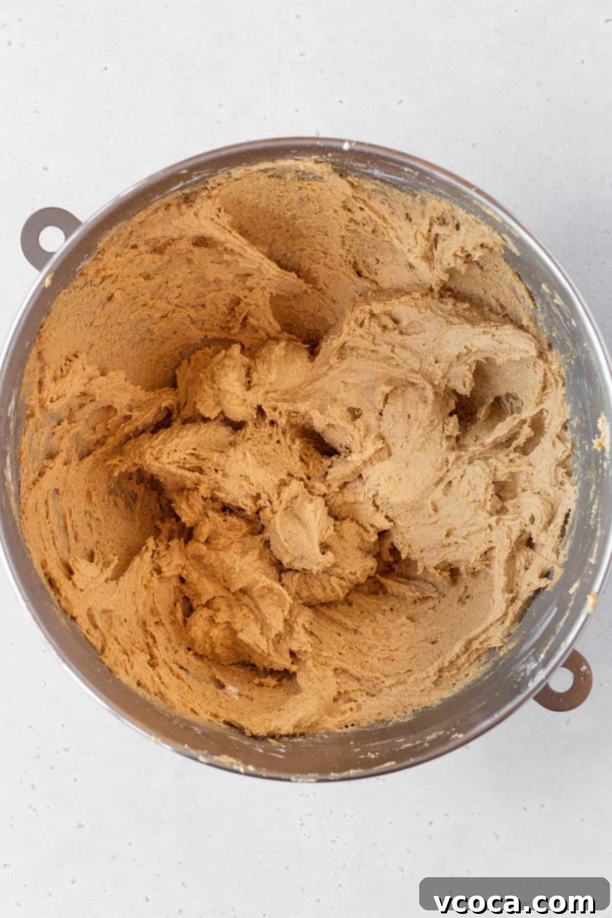 Heavenly Chewy Gluten-Free Ginger Cookies 10 A glistening metal bowl filled with perfectly mixed ginger cookie dough, chilled and ready for baking.