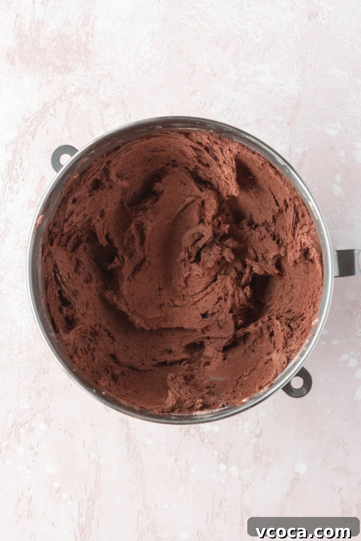 Double chocolate cookie dough in a mixing bowl, after chilling, showing its firm texture.
