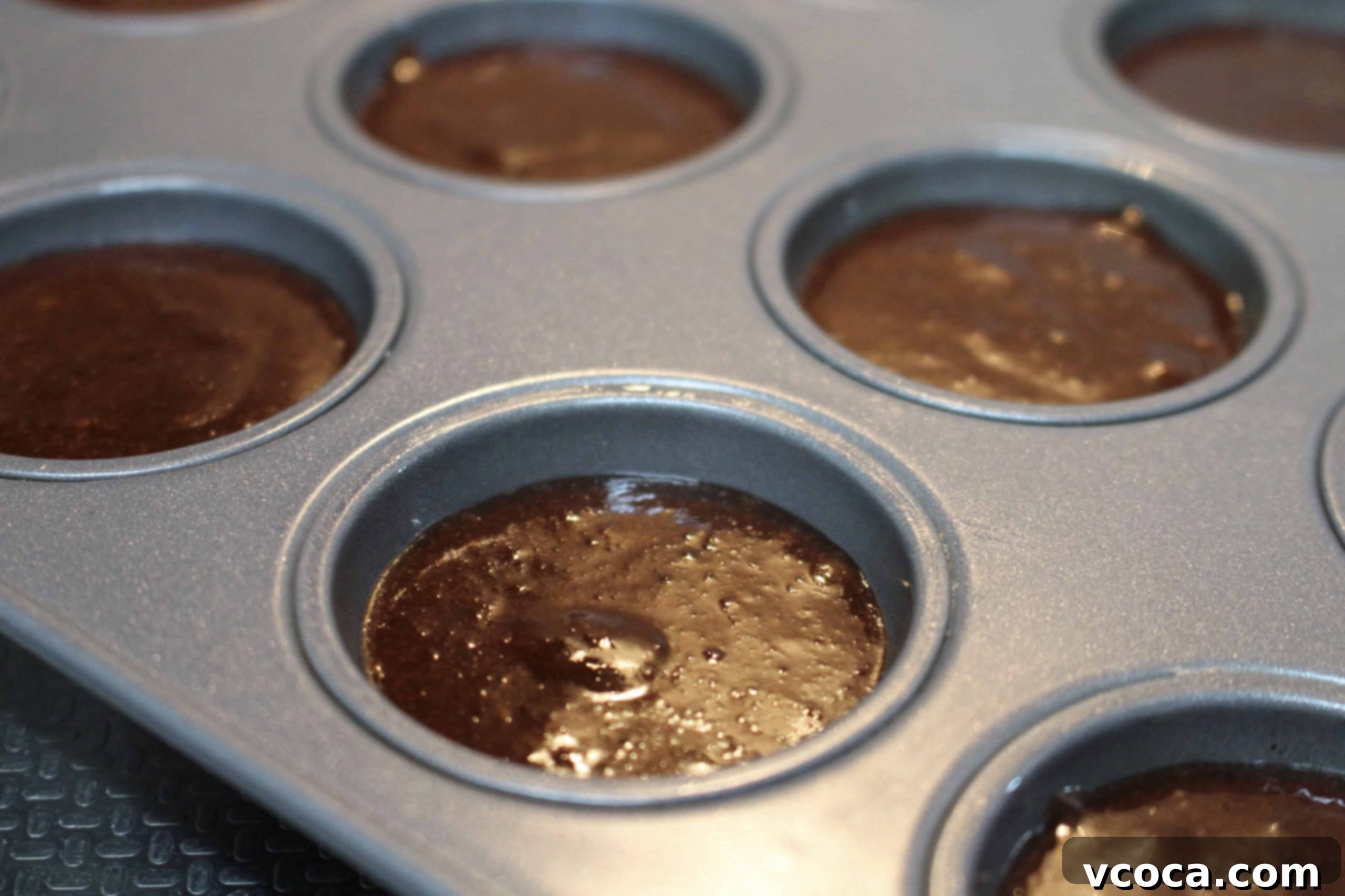 Decadent Chocolate Hazelnut Financiers 5 Mixing honey, egg whites, and cooled browned butter into the dry ingredients for financier batter.