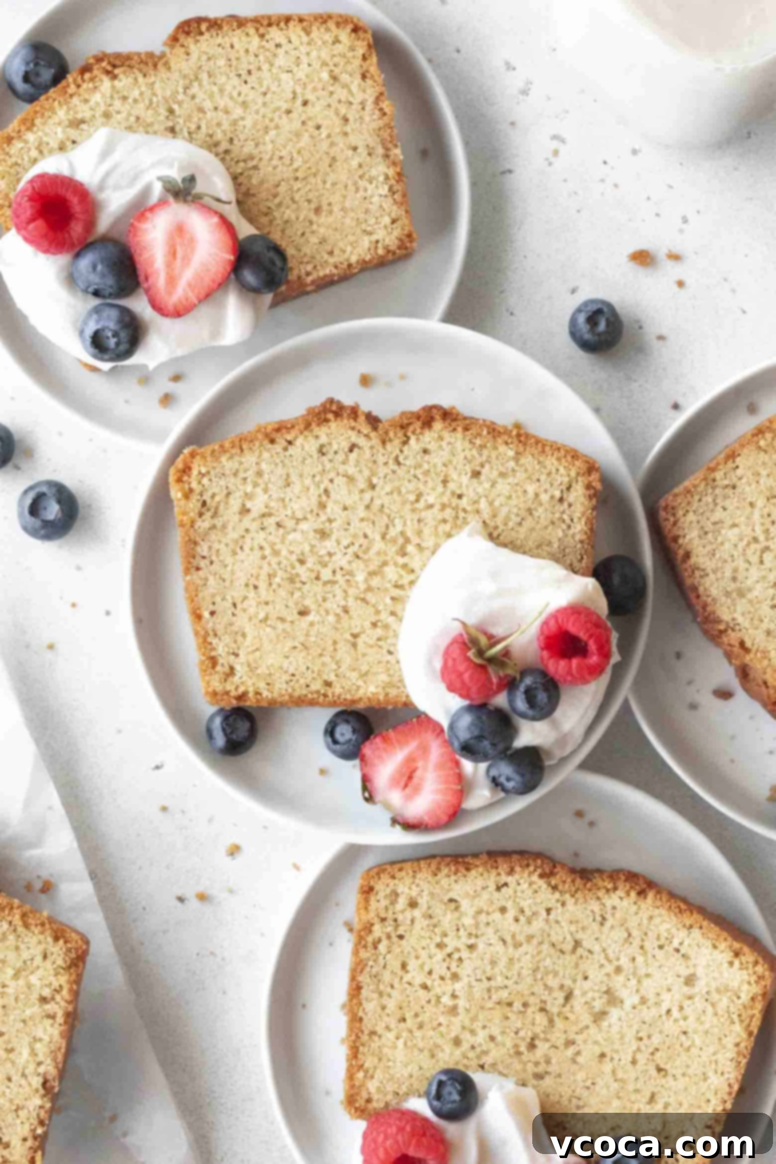 Indulgent Gluten-Free Pound Cake 13 Two slices of tender gluten-free pound cake on plates, ready to be enjoyed.