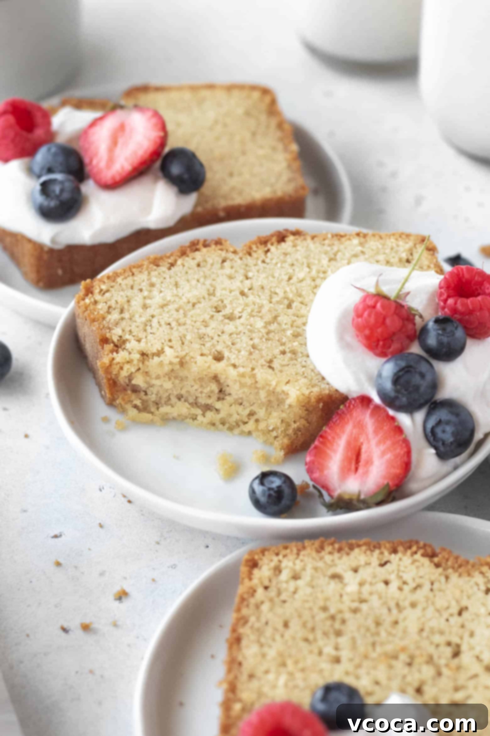 Indulgent Gluten-Free Pound Cake 15 A perfectly baked slice of tender gluten-free pound cake on a white plate, highlighting its moist texture.