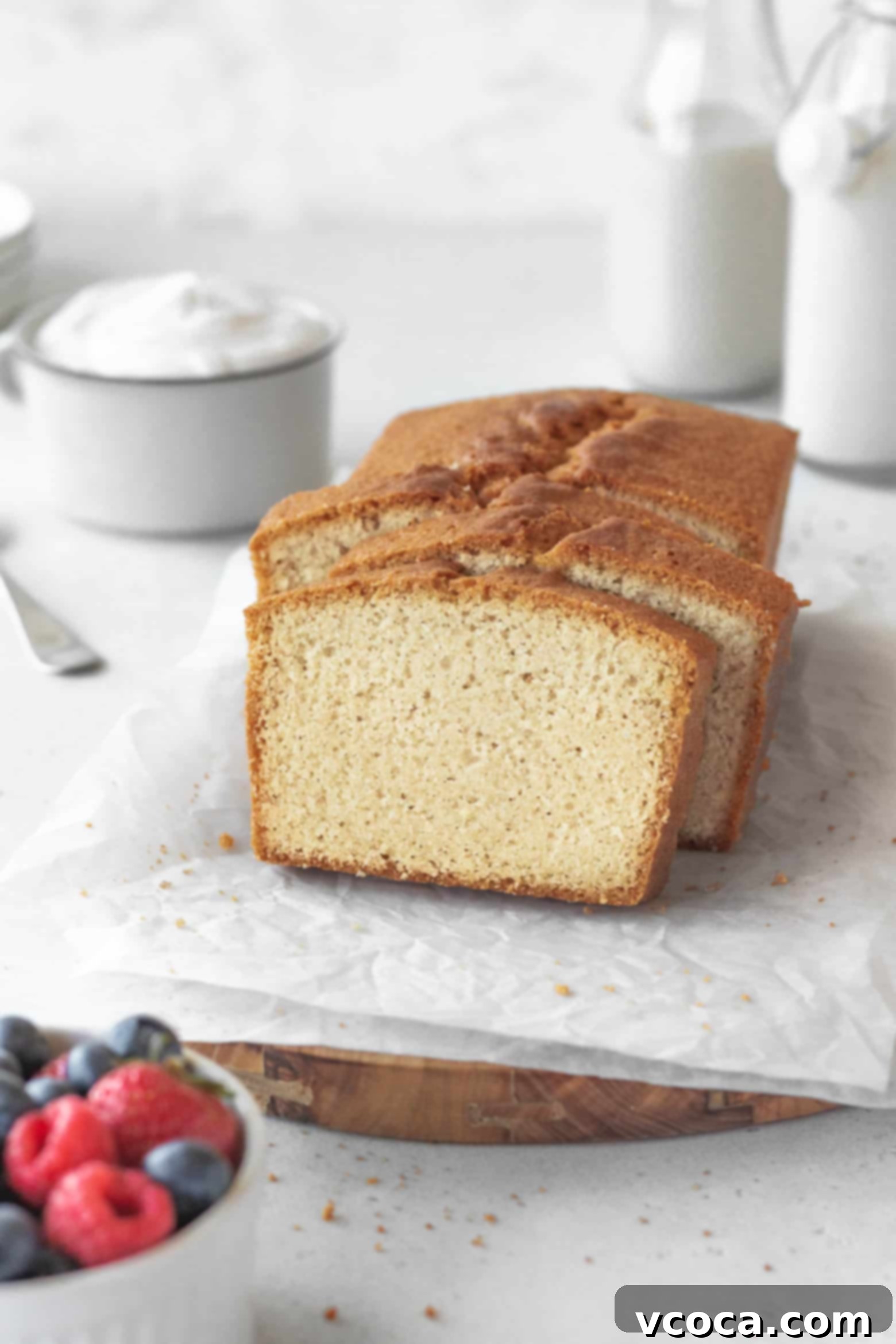 Indulgent Gluten-Free Pound Cake 5 A perfectly baked, sliced loaf of gluten-free pound cake, showcasing its golden crust and moist interior.