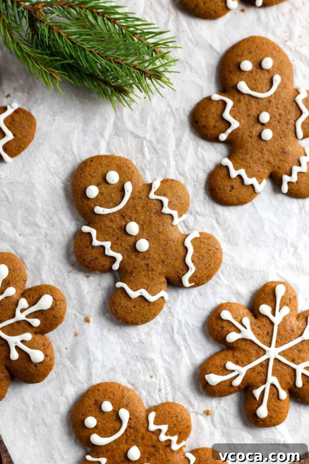 Irresistible Gluten-Free Christmas Treats 4 Gingerbread cookies decorated with white icing.
