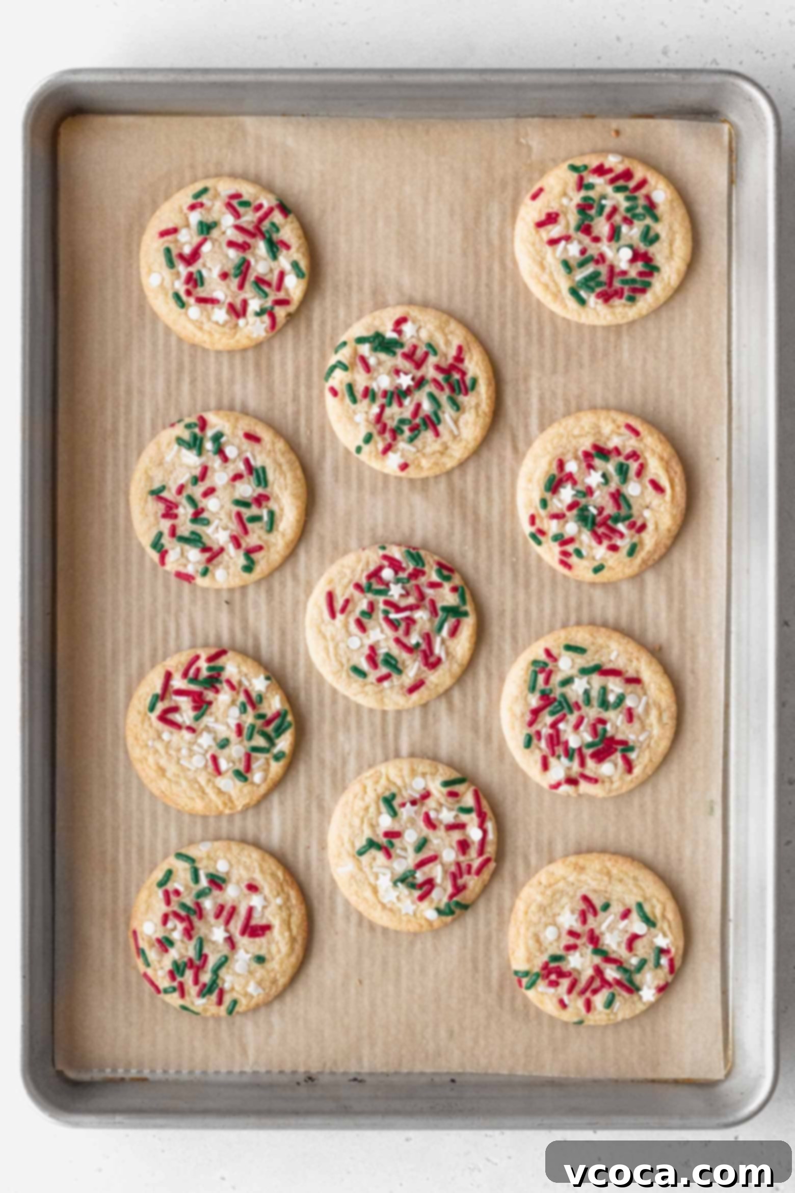 Irresistible Gluten-Free Christmas Treats 18 Baked Christmas cookies on a baking sheet.