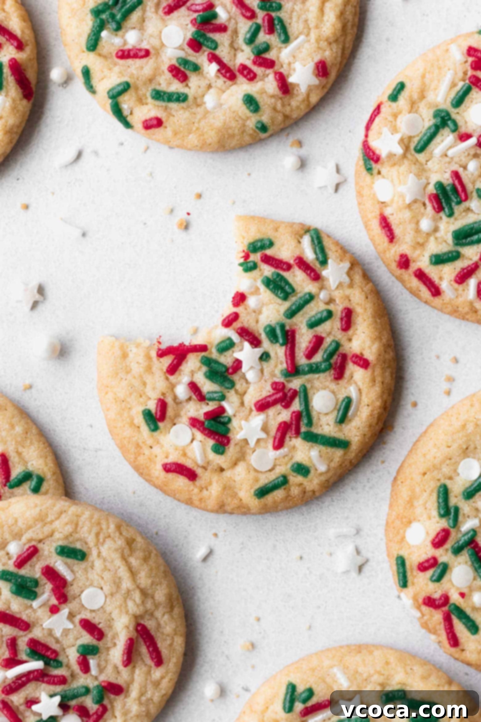 Irresistible Gluten-Free Christmas Treats 20 A Christmas sugar cookie with a bite taken out.