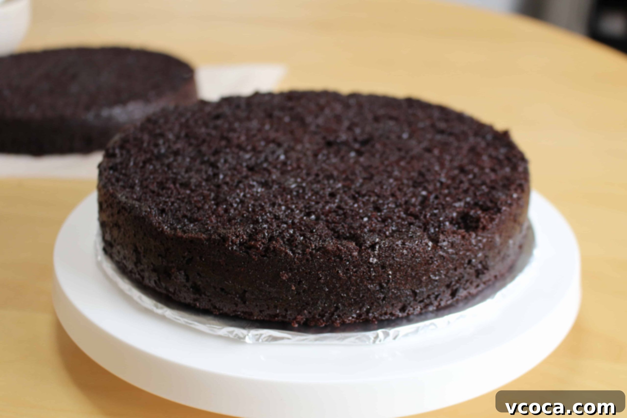 Decadent Mocha Chocolate Cake 3 Two baked chocolate mocha cake layers cooling on a wire rack