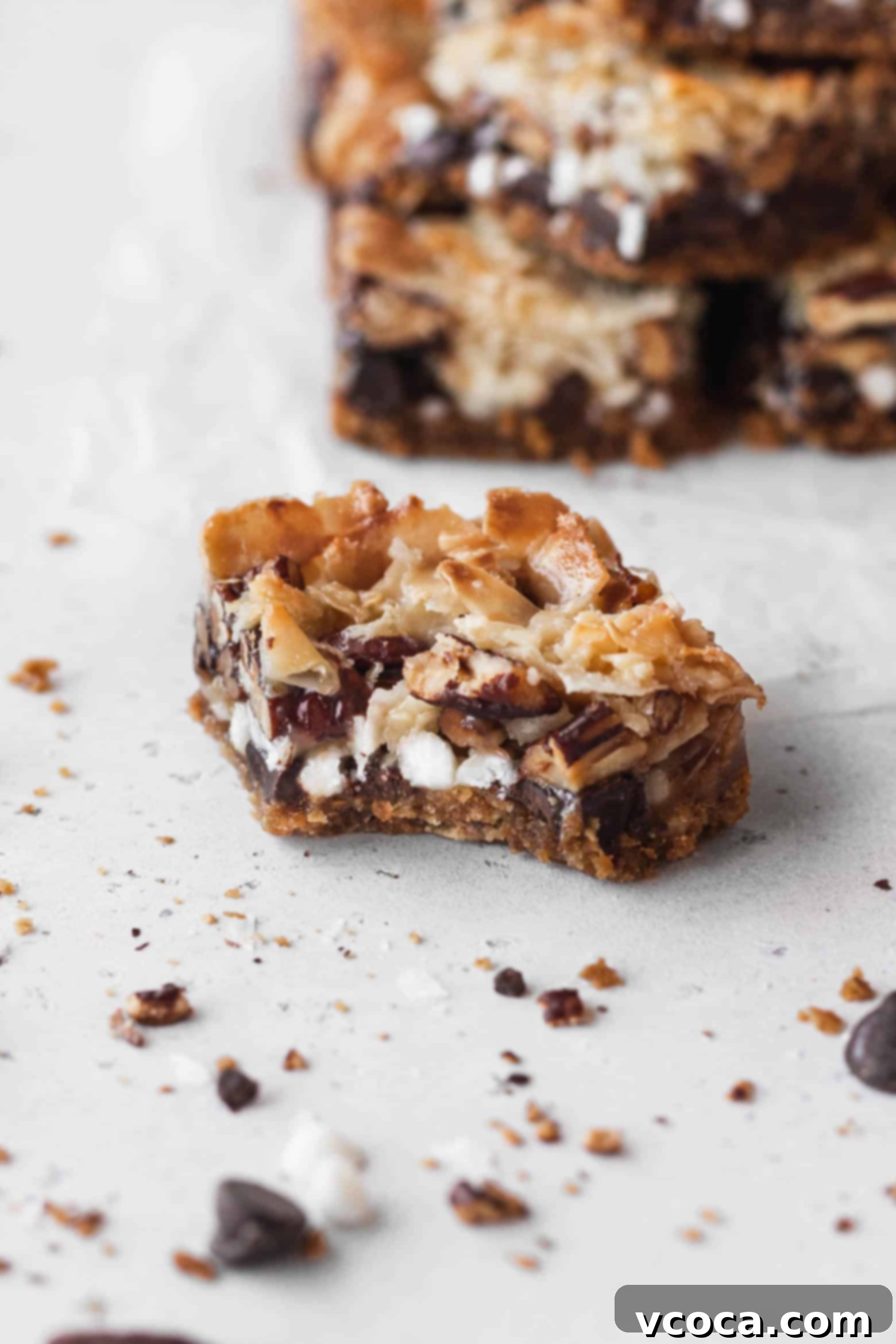 Magical Vegan Seven Layer Bars 15 A bitten piece of vegan 7 layer bars.