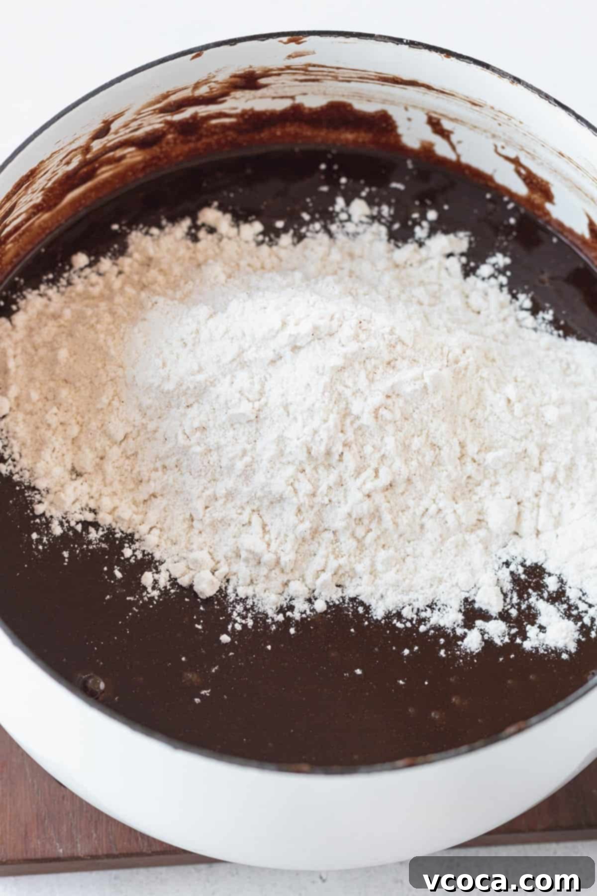 Decadent Gluten-Free Brownies 6 Gluten-free flour blend and salt added to the brownie batter, being mixed until smooth.
