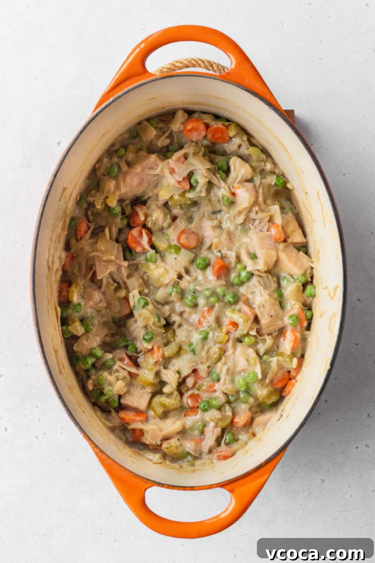 Vegan Chicken Pot Pie 10 Thick, creamy vegan pot pie filling simmering in an enamel pot, ready for the crust.